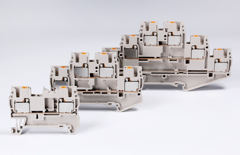  Dinkle’'s DP family of terminal blocks incorporates push-in spring-type connectors with single-, two- and three-layer form factors in a variety of sizes.